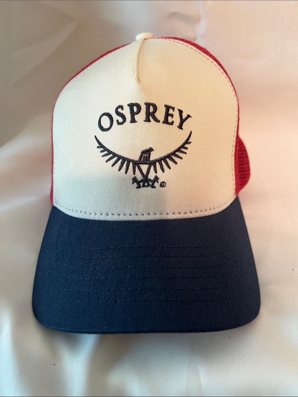 OSPREY Cream Front Navy Brim Red Mesh Trucker Cap